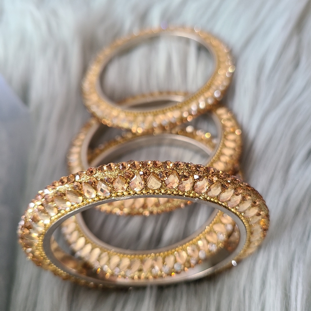 2 Chunky Rhinstoned Bangles.